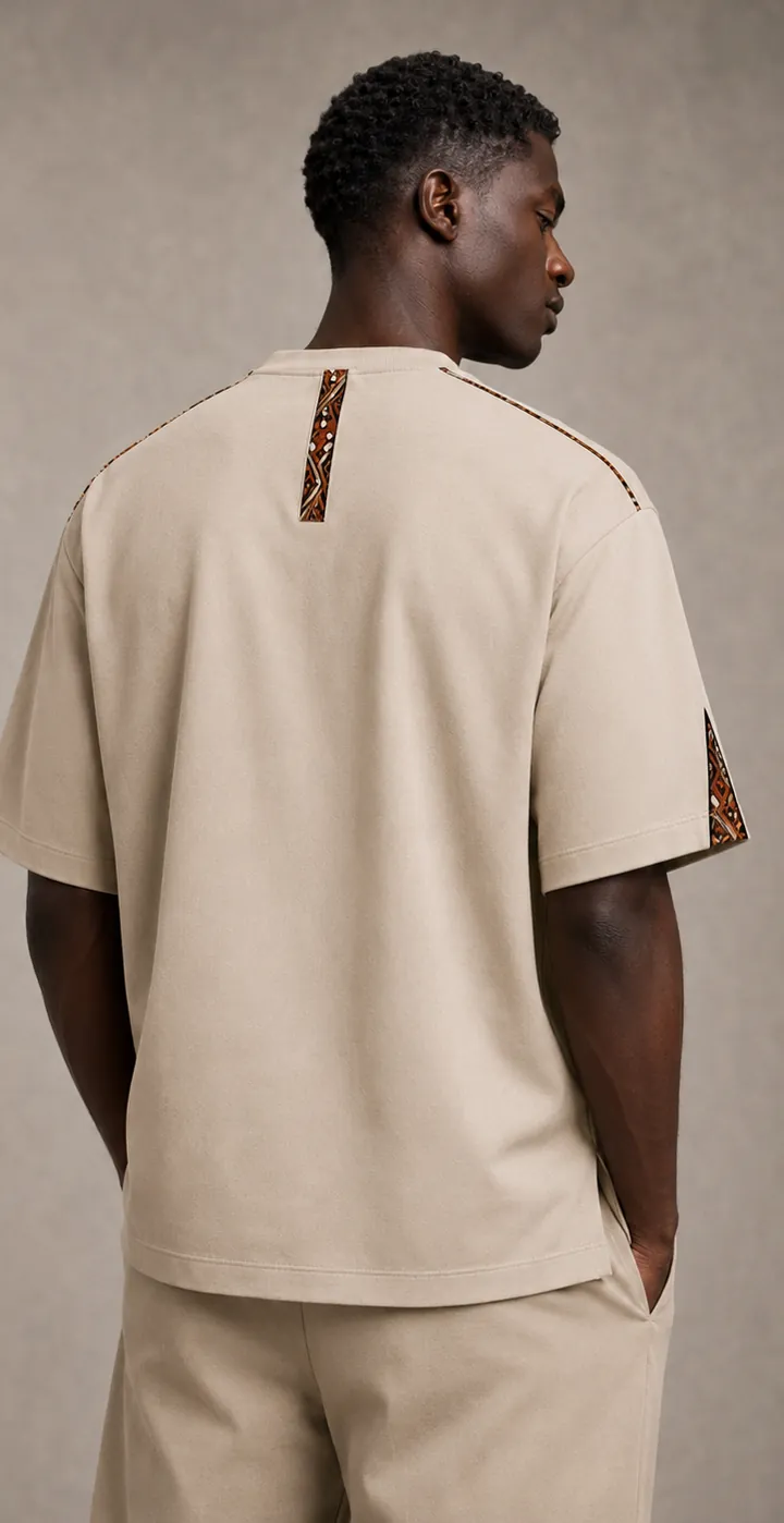 Design concept: beige T-shirt from behind, a narrow Ankara line running down from the collar.